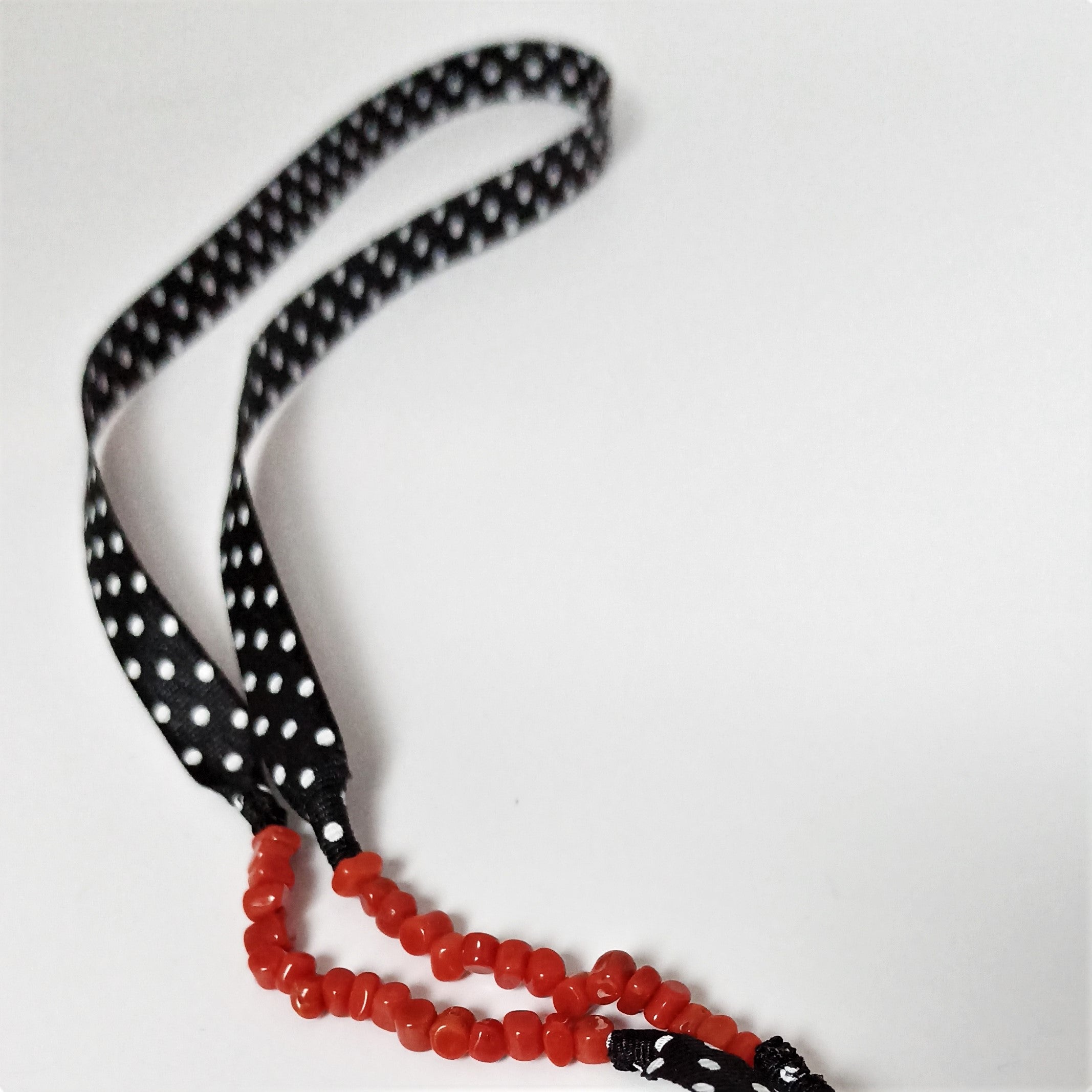 Catenella occhiali a pois e corallo